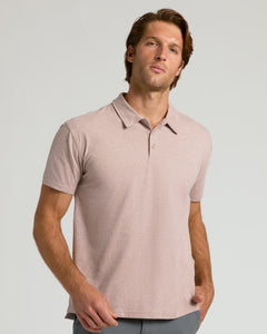 True ClassicYoung man in Light Heather Slate Mauve Classic Polo and neutral pants.
