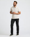Man wearing Seasonal Classic Polo 3-Pack in light beige with black pants.