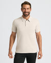 Man wearing Oatmeal Classic Polo with a three-button placket, smiling.