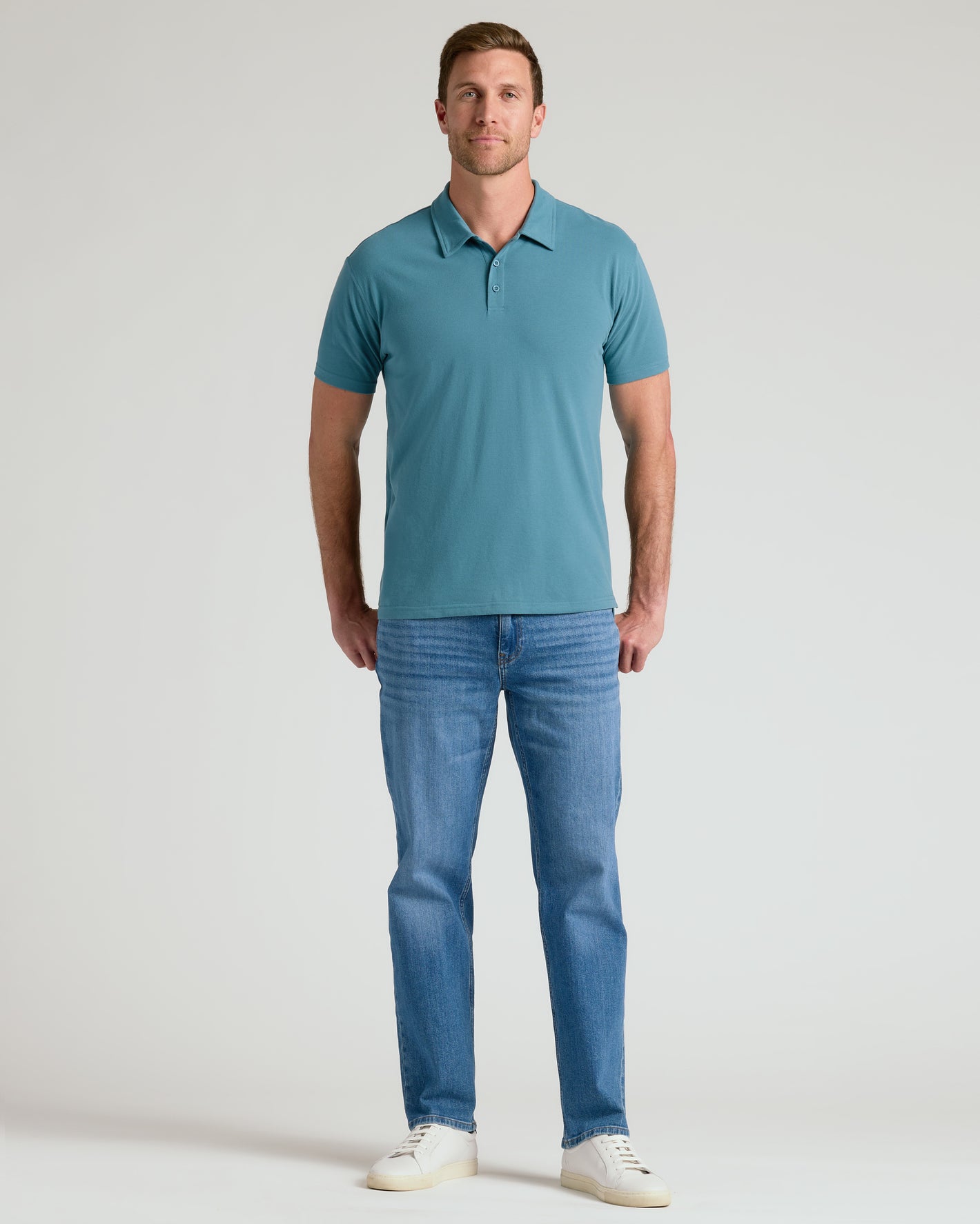 Sapphire Classic Polo worn by man with jeans and sneakers.