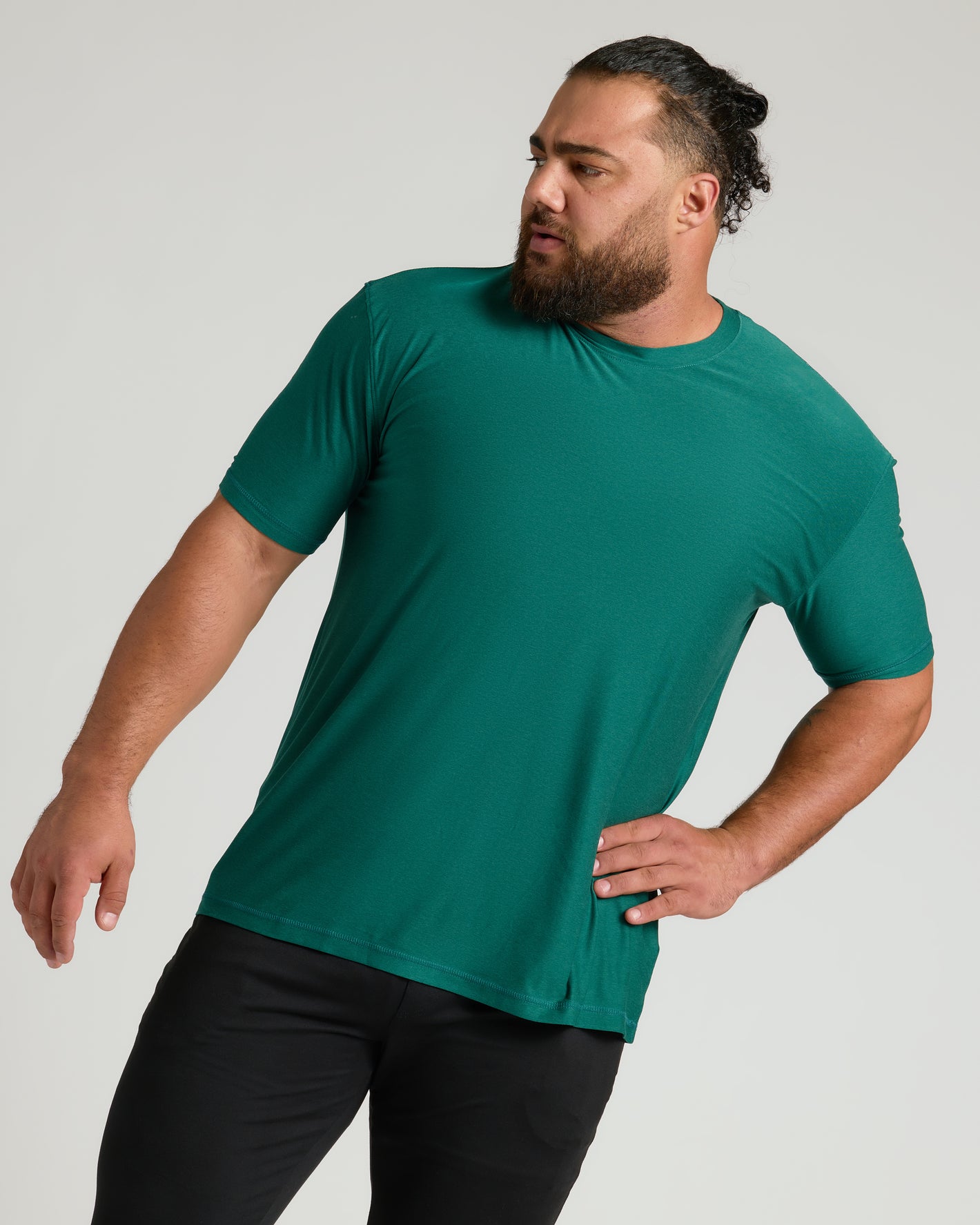 Clover Active Crew Neck Tee worn by bearded man, casual pose.