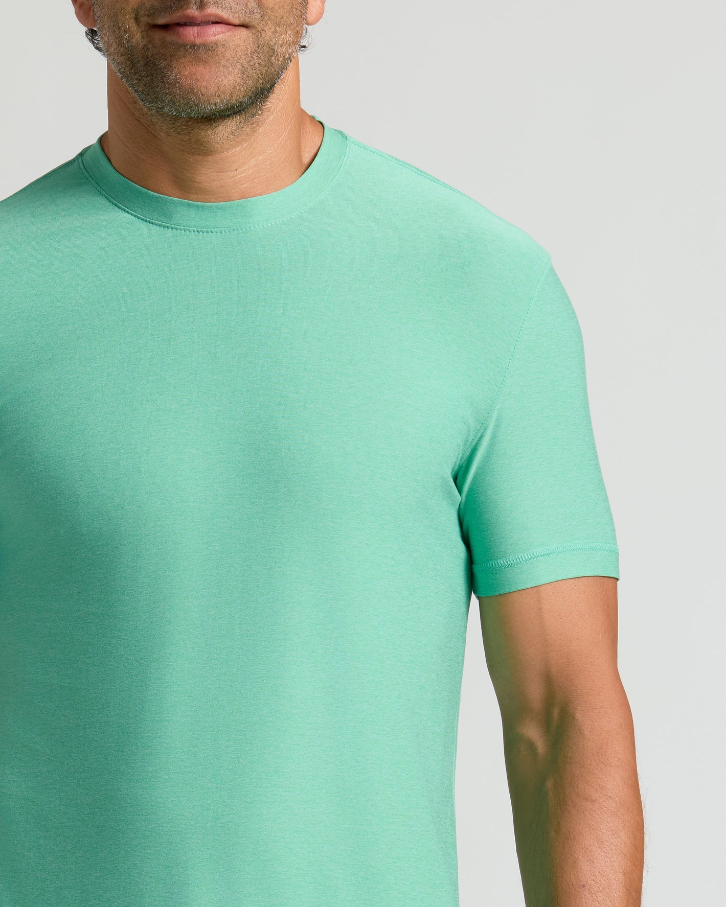 Fern Active Crew Neck Tee in mint-green, showcasing its sleek, athletic fit.