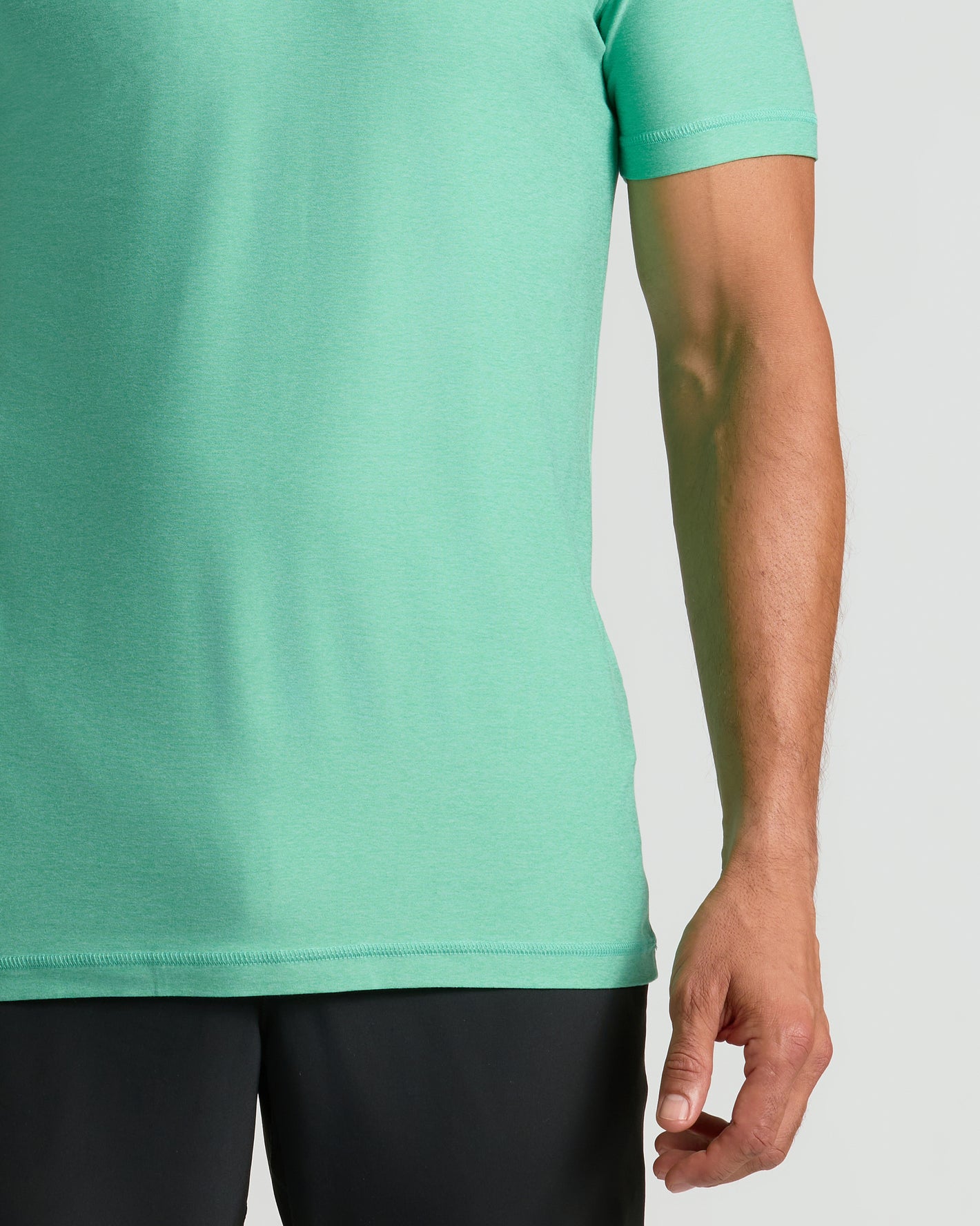 Fern Active Crew Neck Tee on model, showcasing mint-green color and short sleeves.