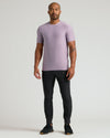 Male model in Iris Active Crew Neck Tee with black joggers.