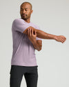 Man stretching in Iris Active Crew Neck Tee.