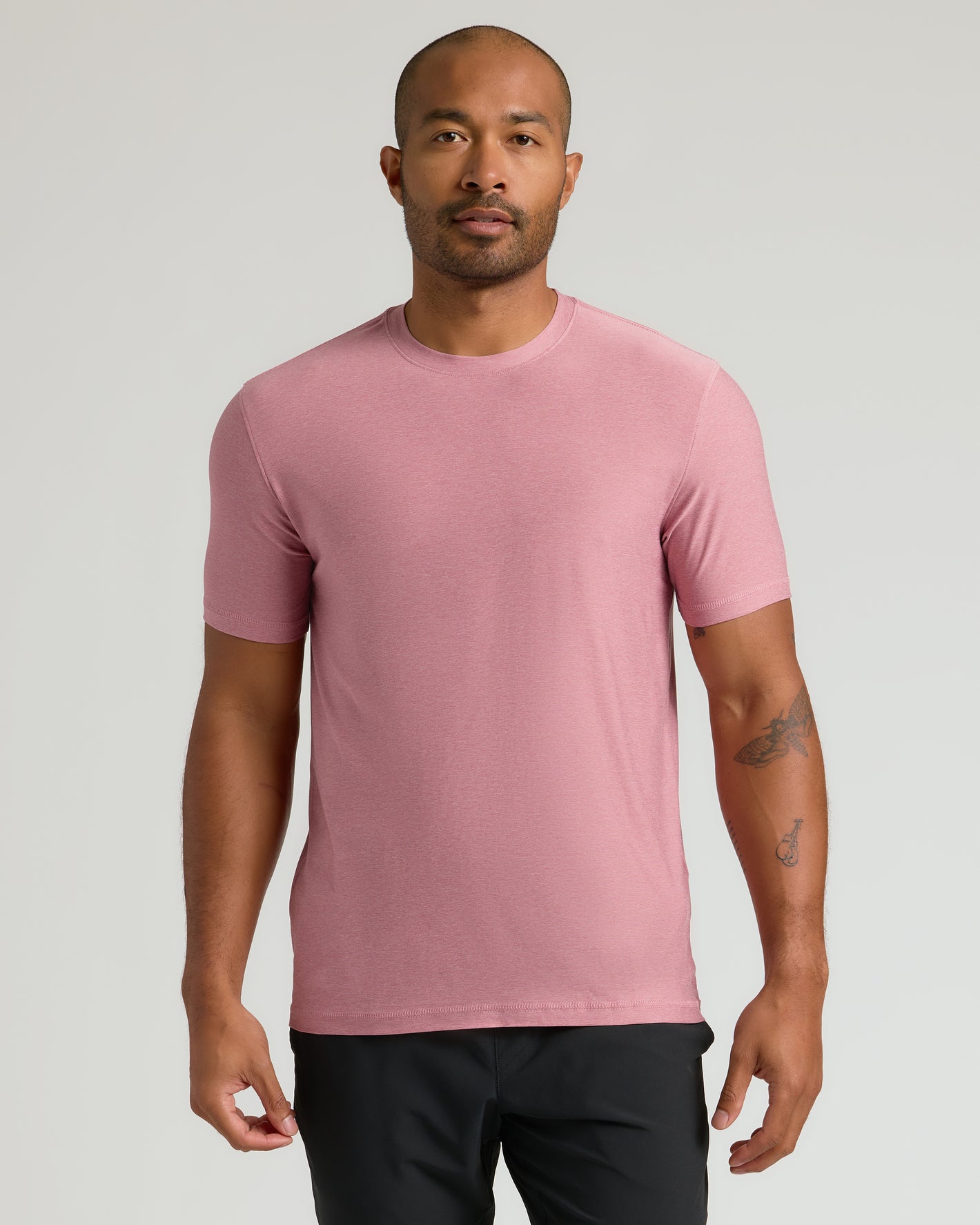 Man wearing Quartz Rose Active Crew Neck Tee, showing tattoos.