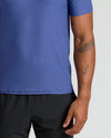Cosmos Active Polo 2.0 with tattoos visible on forearm.