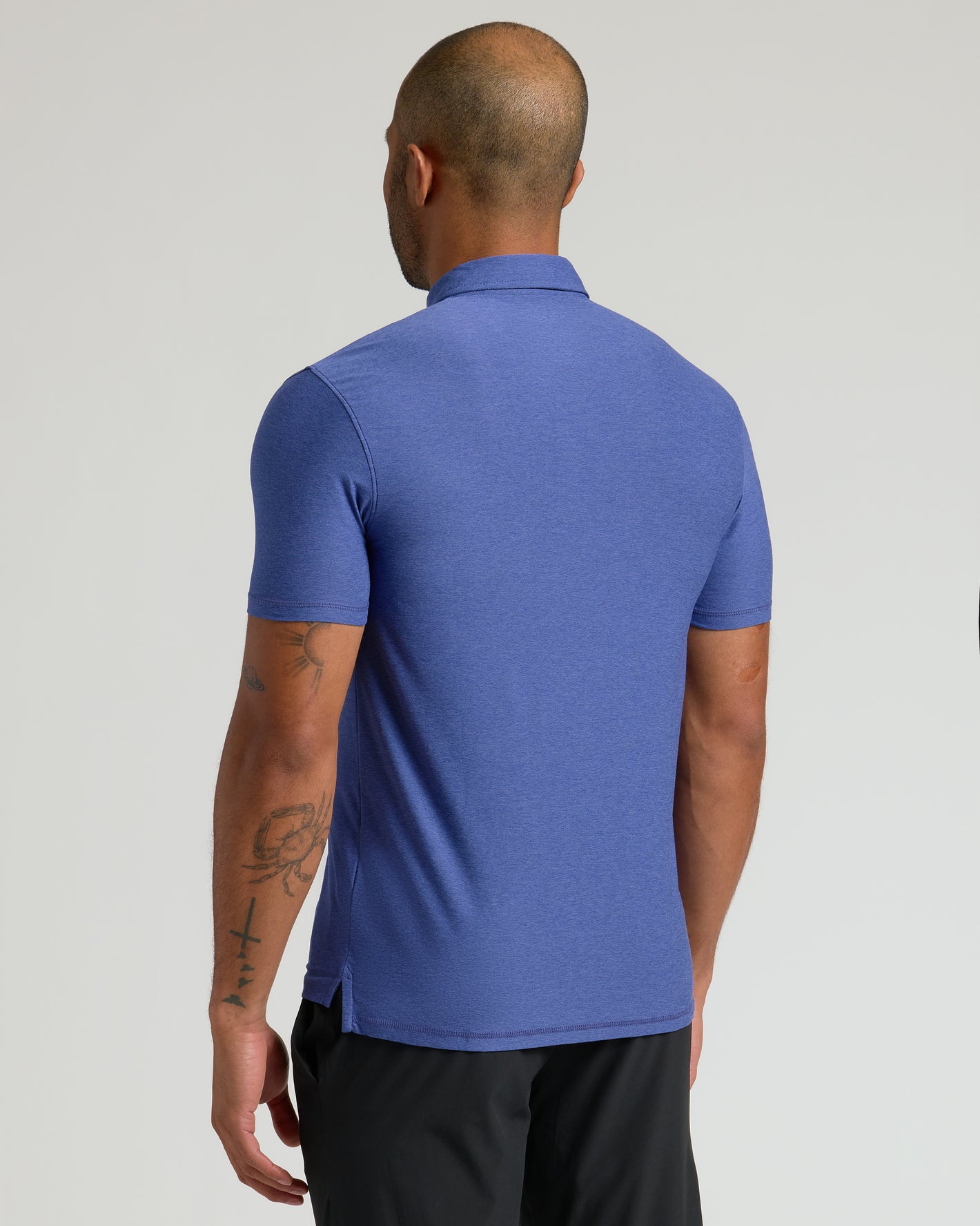 Cosmos Active Polo 2.0 showcasing back tattoos.
