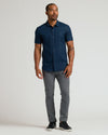 Male model wearing Navy Short Sleeve Linen Shirt and slim-fit trousers.