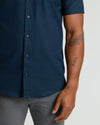 Navy Short Sleeve Linen Shirt worn with gray pants, showcasing arm tattoos.