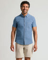 Man wearing Light Indigo Wash Short Sleeve Stretch Chambray Shirt smiling.
