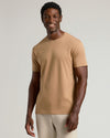 Tahini Premium Pima Crew Neck worn by a smiling man.