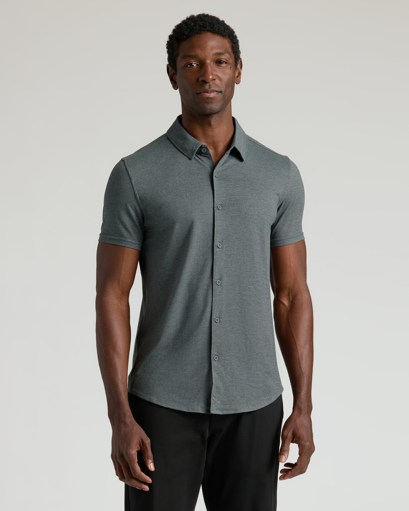 Man models Charcoal Heather Gray Short Sleeve Comfort Knit Shirt.
