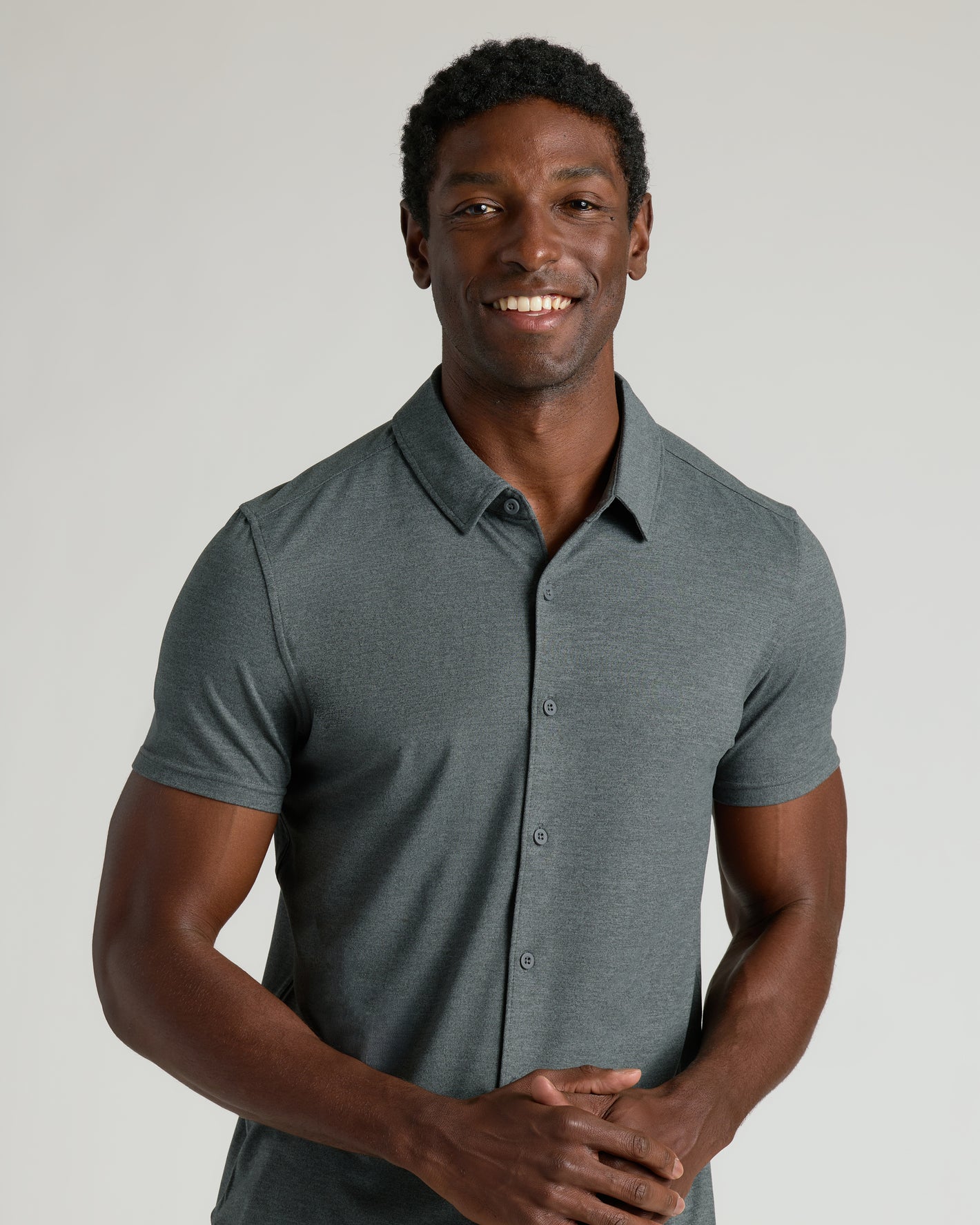 Man models Charcoal Heather Gray Short Sleeve Comfort Knit Shirt.