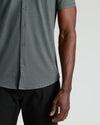Charcoal Heather Gray Short Sleeve Comfort Knit Shirt worn with black trousers.