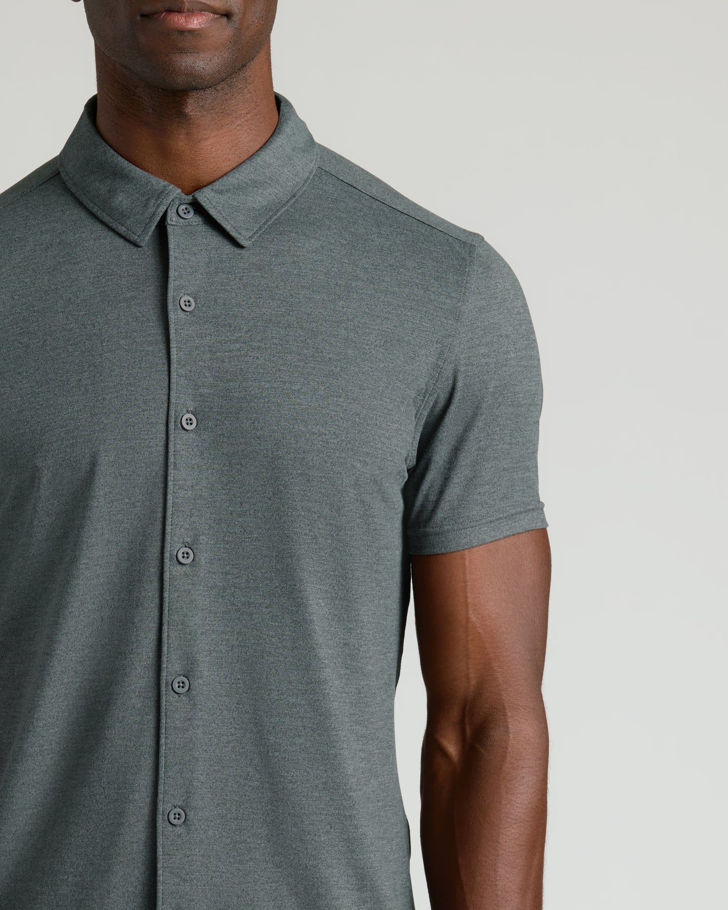 Man wearing Charcoal Heather Gray Short Sleeve Comfort Knit Shirt.