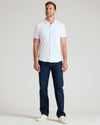 White Short Sleeve Comfort Knit Shirt on man, relaxed pose, casual style.