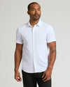 Man models White Performance Dress Shirt with button-up design.