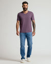 Man wearing Dark Heather Plum Classic V-Neck with jeans and sneakers.
