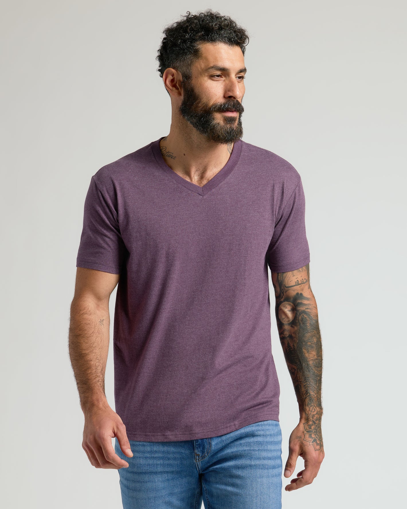 Man in Dark Heather Plum Classic V-Neck, showcasing fit and comfort.