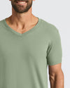 Man wearing Seasonal Classic V-Neck in light green, smiling.