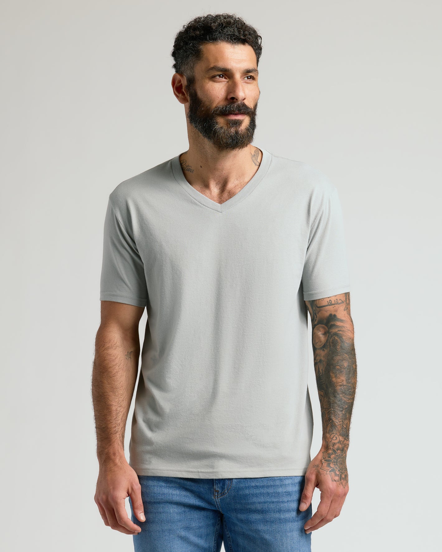 Steel Classic V-Neck on man with tattoos, highlighting fit and comfort.