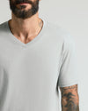 Steel Classic V-Neck on bearded man, showcasing tattoos and fit.