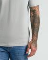 Steel Classic V-Neck worn with tattooed arm visible.