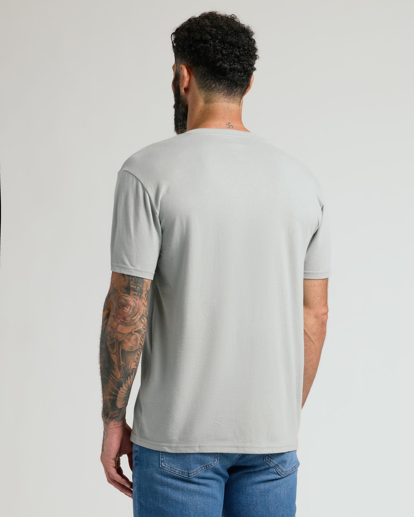 Steel Classic V-Neck on man with tattooed arm, emphasizing fit.