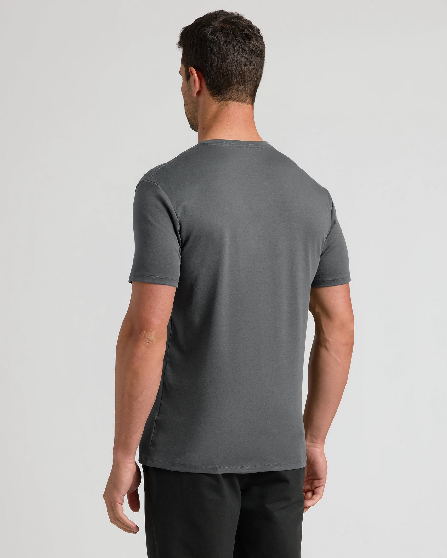 Back view of Carbon Premium Pima V-Neck on model.