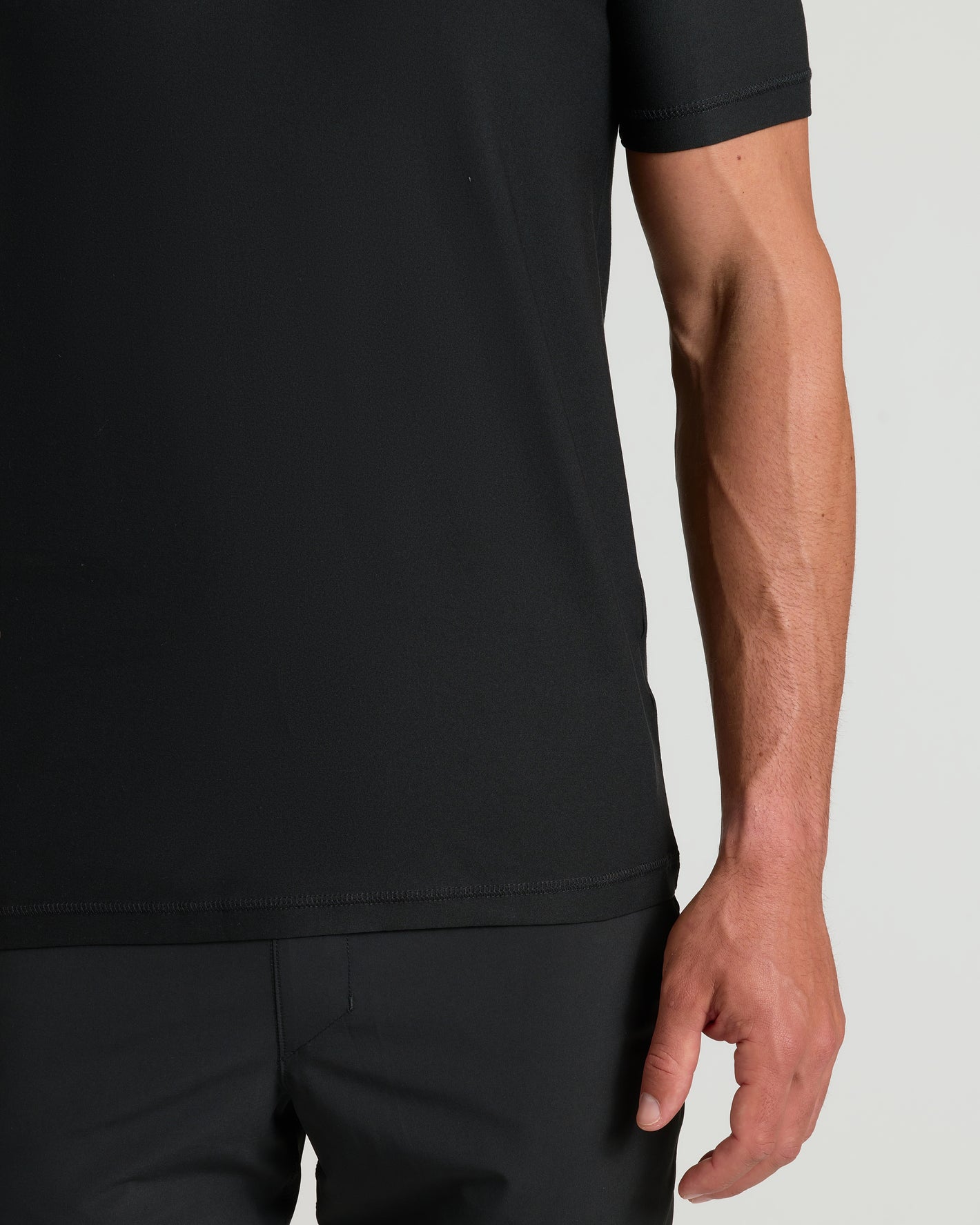 Man wearing Black Active V-Neck, showcasing its modern fit and breathable comfort.