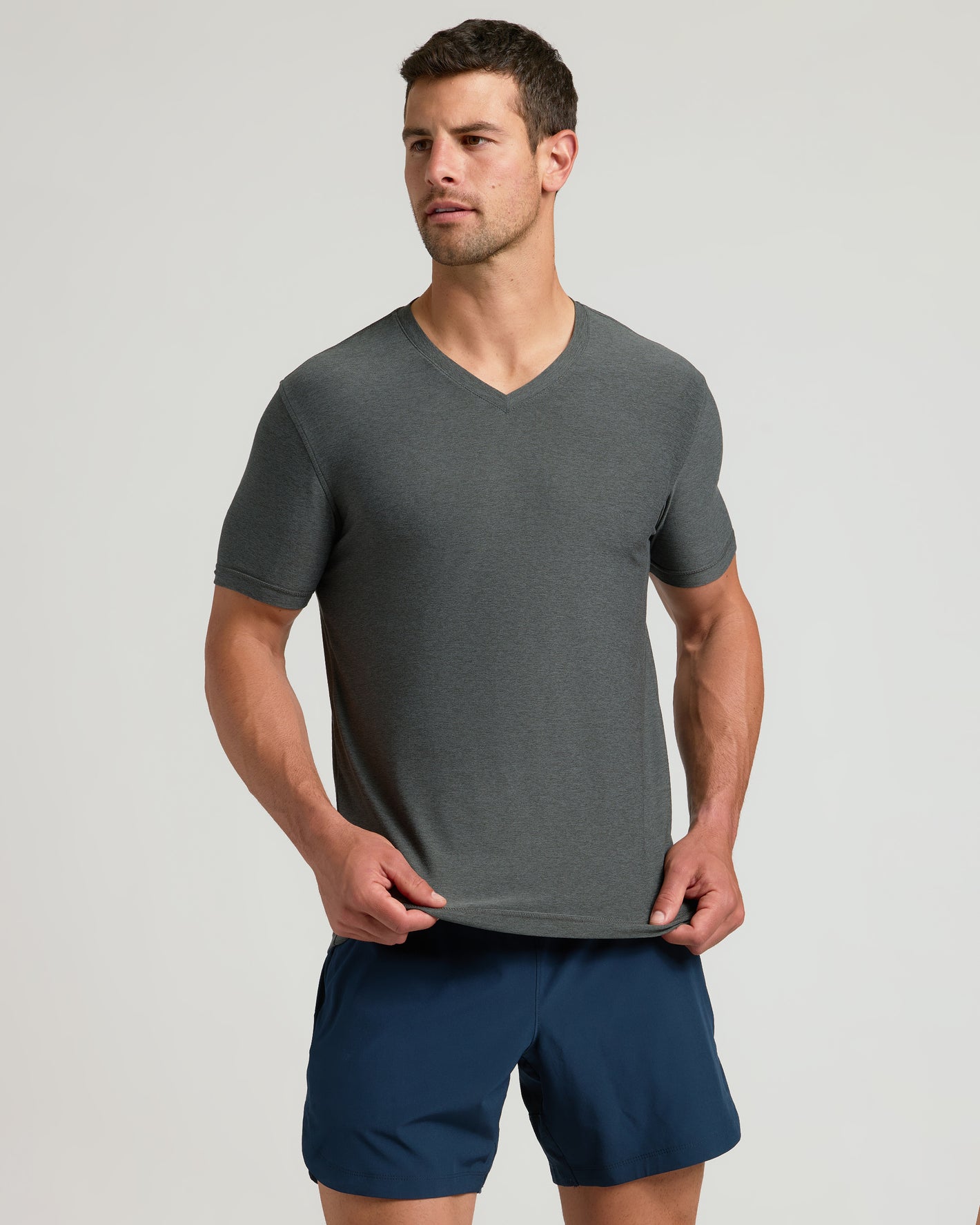 Man models Timeless Active V-Neck T-shirt with modern fit.