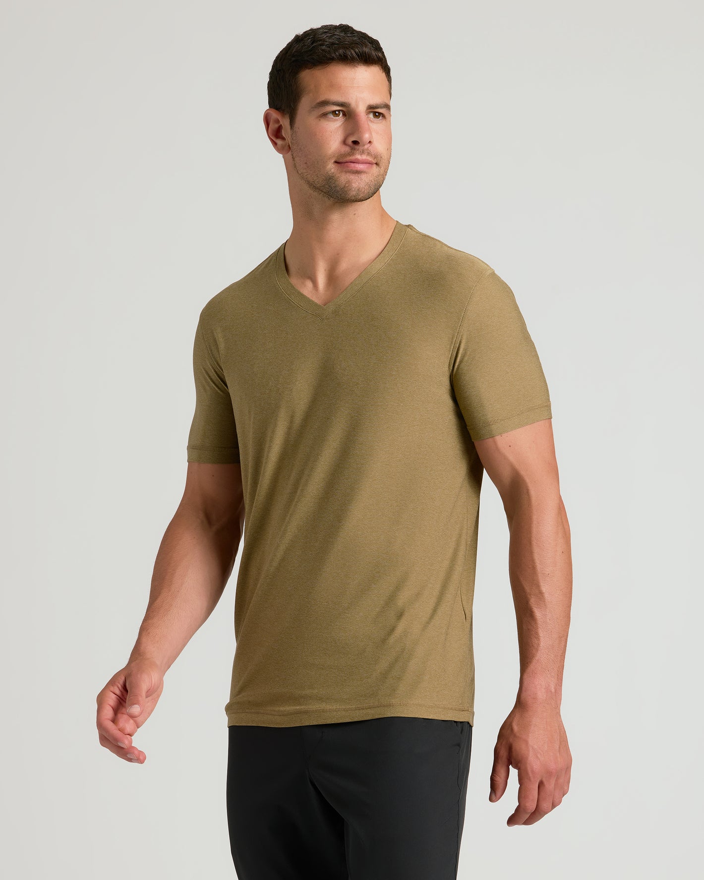 Man in olive Active V-Neck from 6-Pack, casual pose.