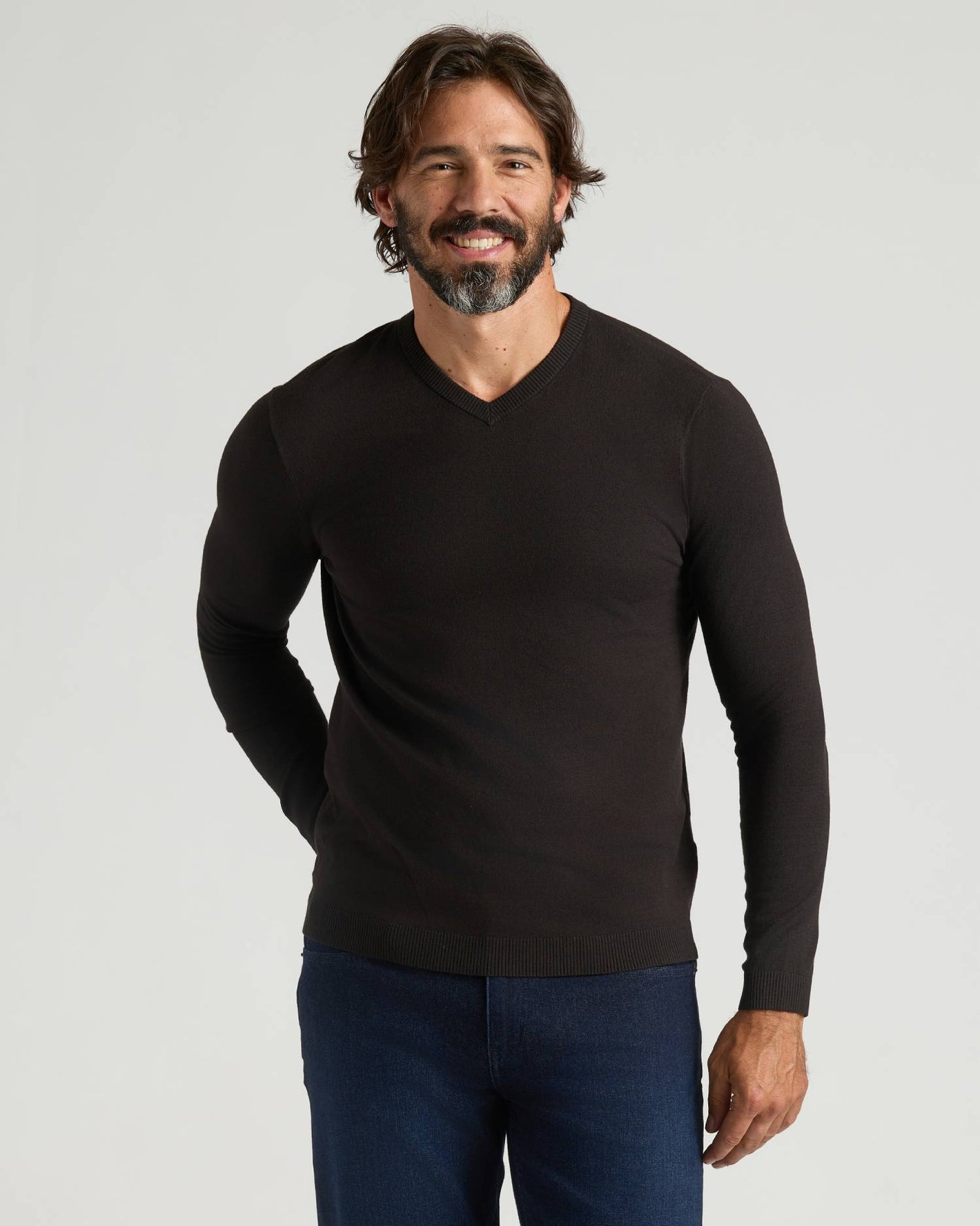 Man in All Black Dressy V-Neck Sweater 2-Pack, smiling gently.
