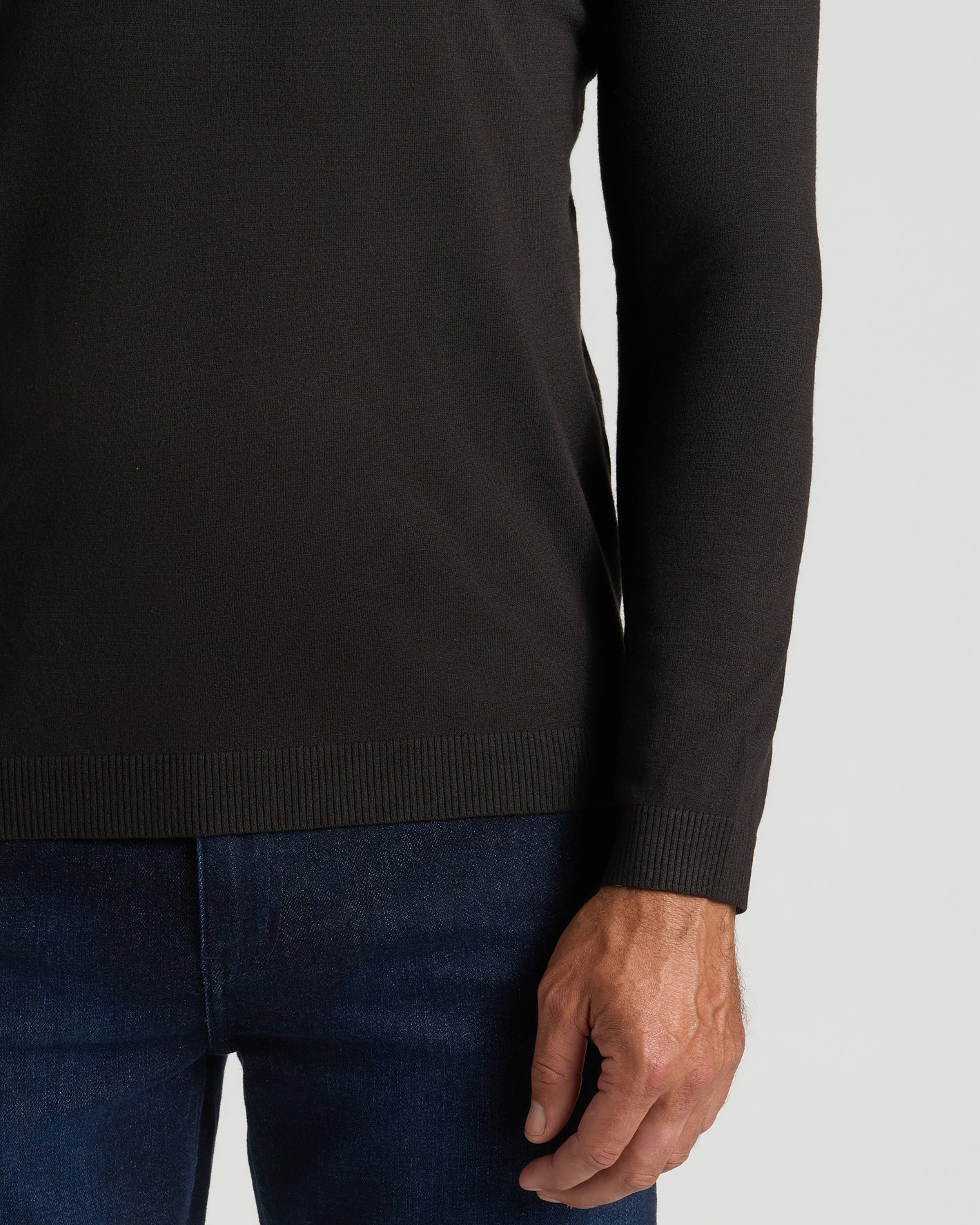 Black Dressy V-Neck Sweater worn with dark blue jeans.