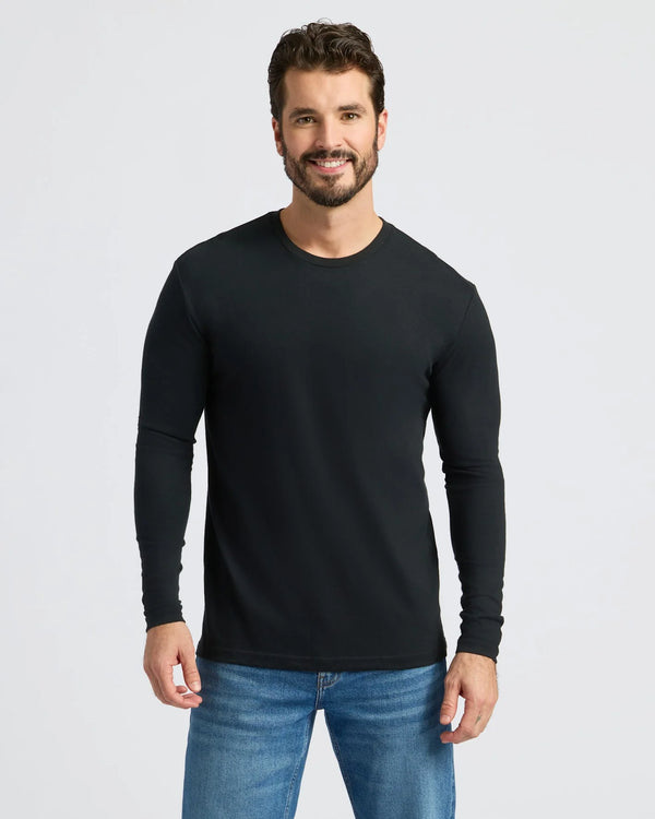 Man in Cool Tones Variety 9-Pack, wearing black crewneck and blue jeans, smiling.