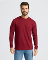 Man wearing Classic Long Sleeve Crew Neck in burgundy with blue jeans.