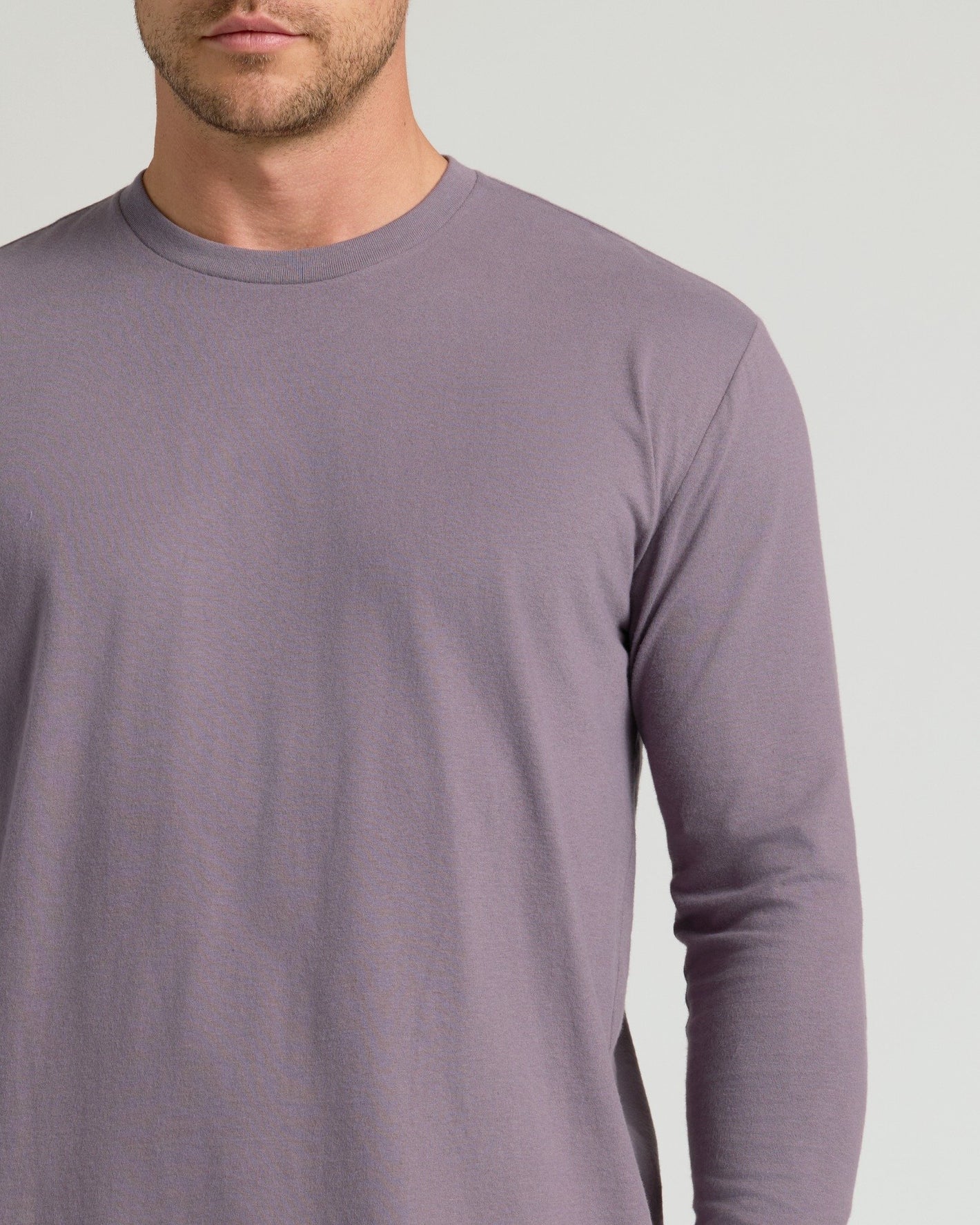 Man wearing Ashberry Classic Long Sleeve Crew Neck shirt, visible neckline.