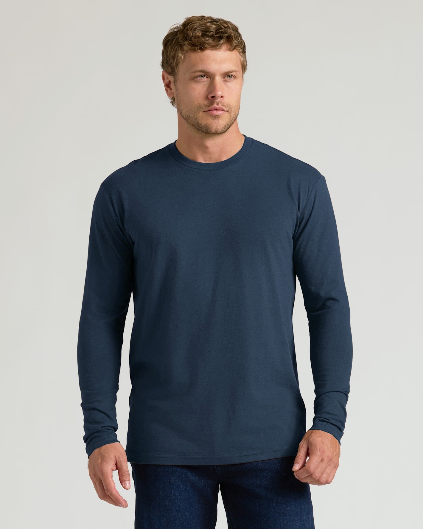 Male model in navy Classic Long Sleeve Crew Neck.