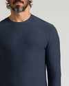 Man wearing a dark blue long sleeve crew neck shirt made of soft fabric, showcasing the Dark Heather Fiord Active Long Sleeve Crew T-Shirt in a classic fit, suitable for men's basics.