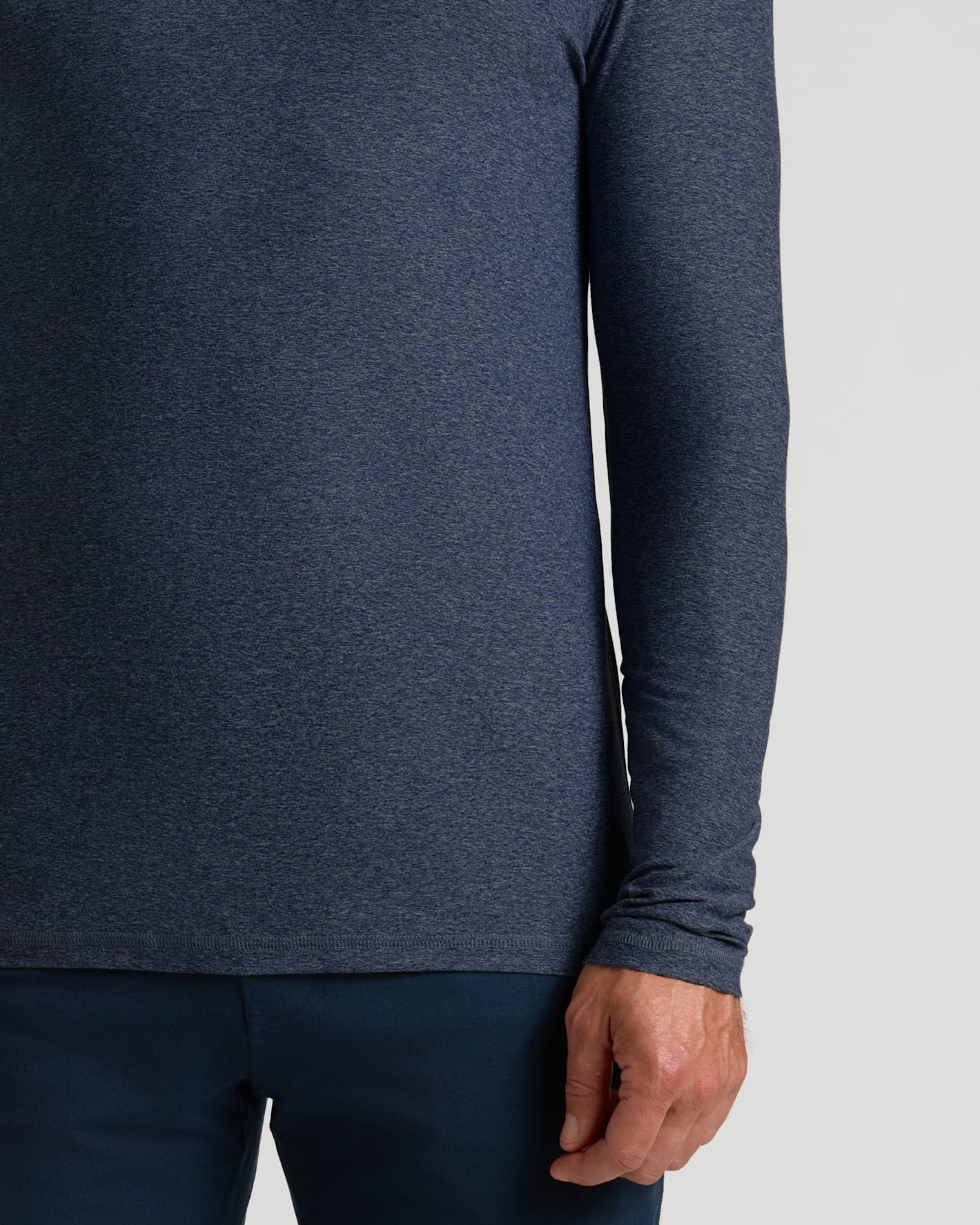Close-up of a men's Dark Heather Fiord Active Long Sleeve Crew T-Shirt in dark blue heather fabric, showing the comfortable fit on the arm and torso.