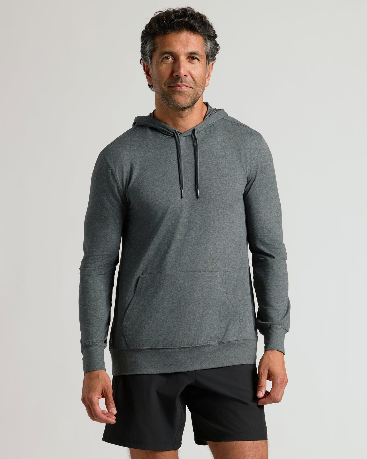 Charcoal Heather Active Comfort Pullover Hoodie on man, relaxed pose.