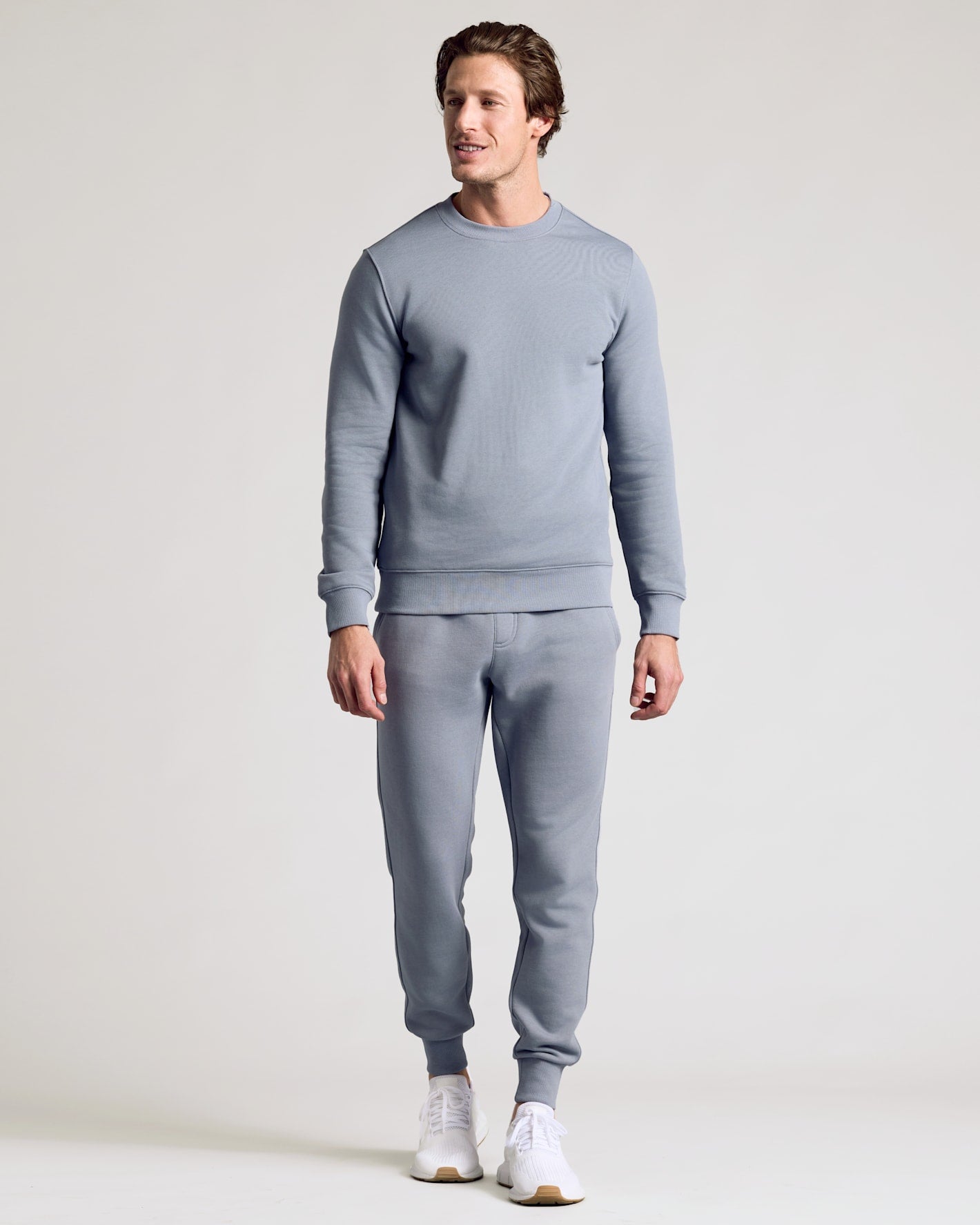 Man wearing Dusty Blue Fleece French Terry Pullover Crew Neck with joggers.