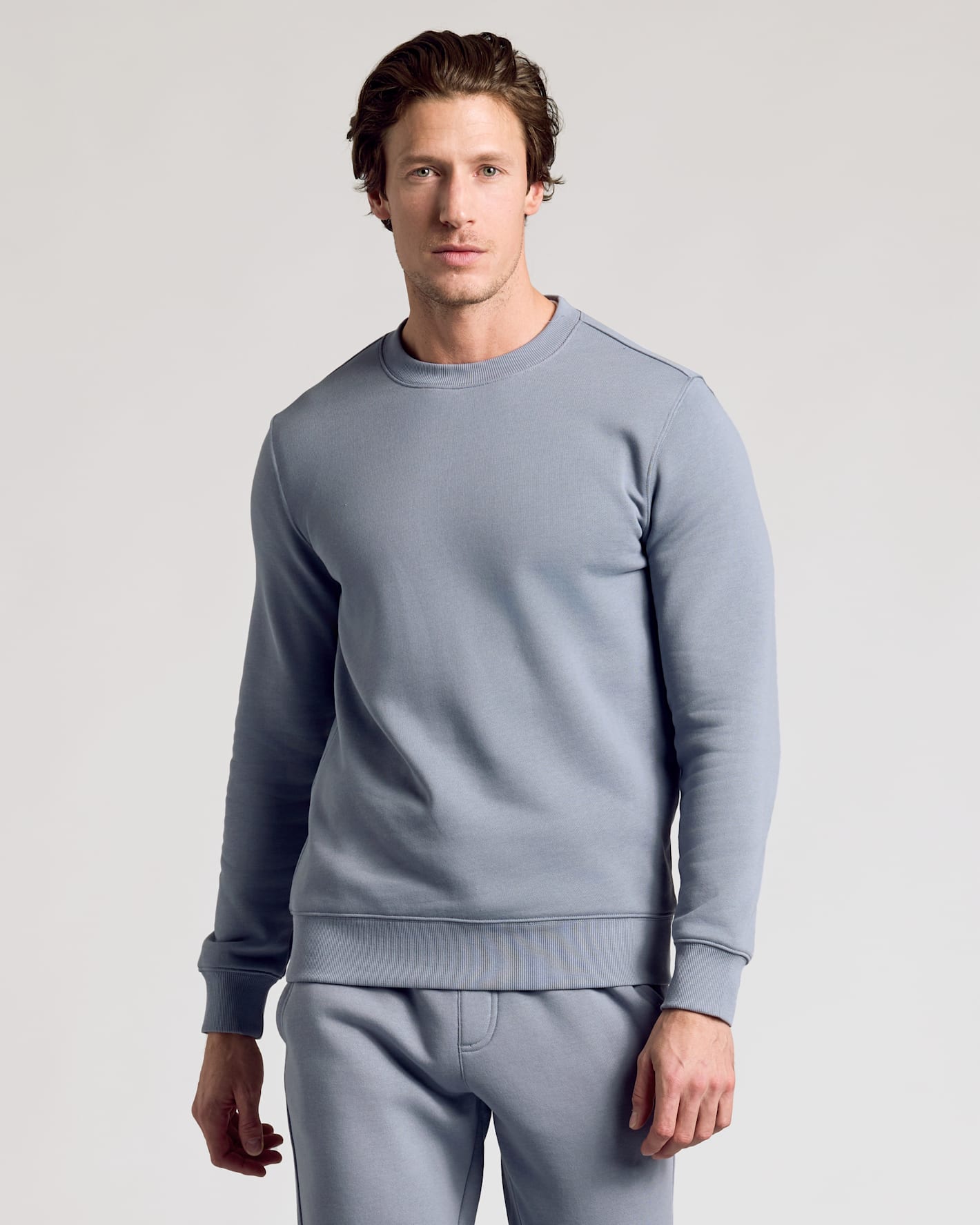 Dusty Blue Fleece French Terry Pullover Crew Neck on male model.