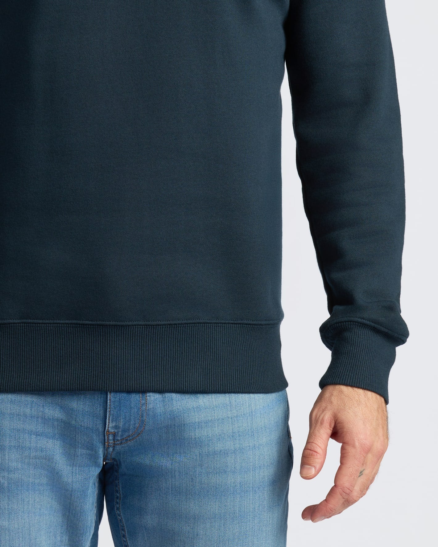 Navy Fleece French Terry Pullover Crew Neck with light-wash jeans.