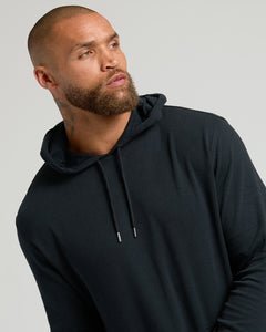 True ClassicMan wearing Black Waffle Hoodie with kangaroo pocket, against gray background.