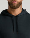Bearded man in All Black Classic Waffle Hoodie.