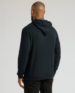 True ClassicMan wearing All Black Classic Waffle Hoodie, back view, hood down.