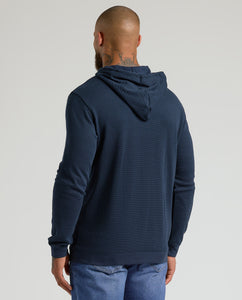 True ClassicMan wearing Heather Gray & Navy Waffle Hoodie, back view.