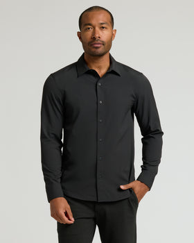 Man wearing Black & White Long Sleeve Performance Dress Shirt from 2-Pack.